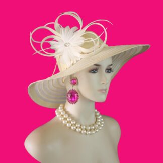 Women's Formal Couture Beige Wide Brim Designer Hat. This Custom Made Fashion Hat Is Embellished With A Handmade Natural Whitened Sinamay Straw Looped Bow White Feather Flower. A Large Acrylic Rhinestone Is Placed In The Center Of The Beautiful Feather Flower For Added Design. Delicate Goose Biot Feathers Are Placed With The Bowing. A Decorative Beige Sequin Trim Encircles The Lower Portion Of The Crown.