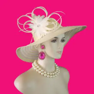 Women's Formal Couture Beige Wide Brim Designer Hat. This Custom Made Fashion Hat Is Embellished With A Handmade Natural Whitened Sinamay Straw Looped Bow White Feather Flower. A Large Acrylic Rhinestone Is Placed In The Center Of The Beautiful Feather Flower For Added Design. Delicate Goose Biot Feathers Are Placed With The Bowing. A Decorative Beige Sequin Trim Encircles The Lower Portion Of The Crown.